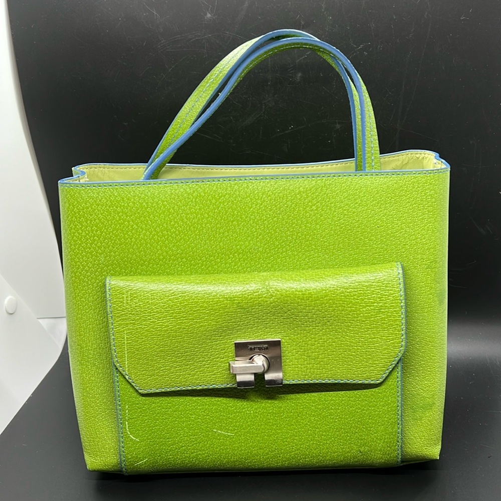 Tumi lime green leather handbag with cornflower blue edging.